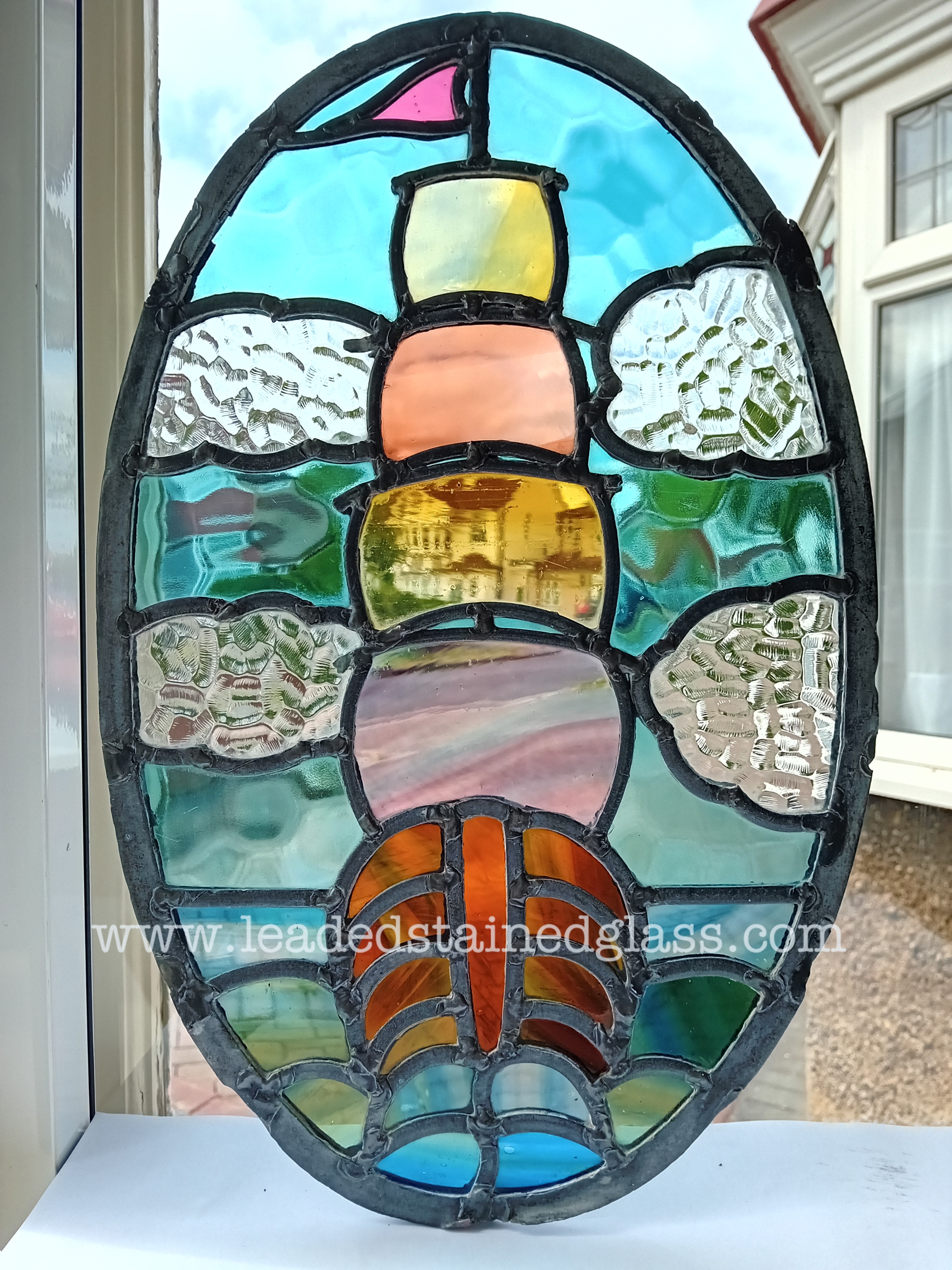 A1682. Oval leaded stained glass window fragment galleon ship